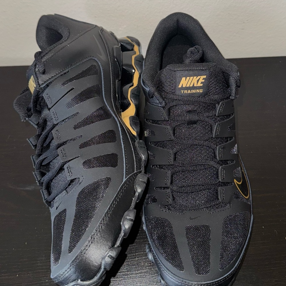 Nike Black and Gold Reax
